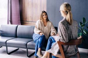 Two people talking at a dual diagnosis treatment center near Denver in Colorado