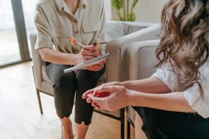 Hands of two people at a transitional living program near Denver in Colorado