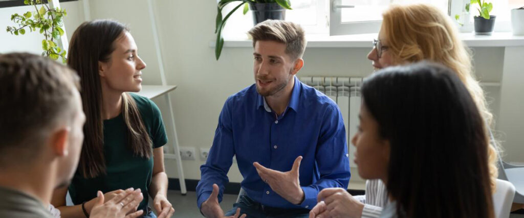 People sitting in a circle at a partial hospitalization program session