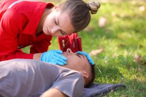 A paramedic attends to a man experiencing an opioid overdose after using fentanyl.